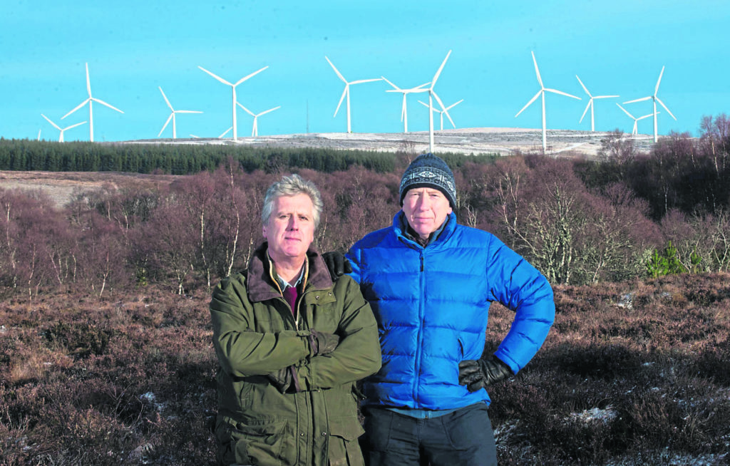There are plans to expand the number of wind turbines around the village of Dallas, Moray. In photo Mark Houldsworth (left) and George Herraghty they are members of Save Wild Moray, a group set up to stop the wind turbines. Photo by Michael Traill 9 South Road Rhynie Huntly AB54 4GA Contact numbers Mob07739 38 4792