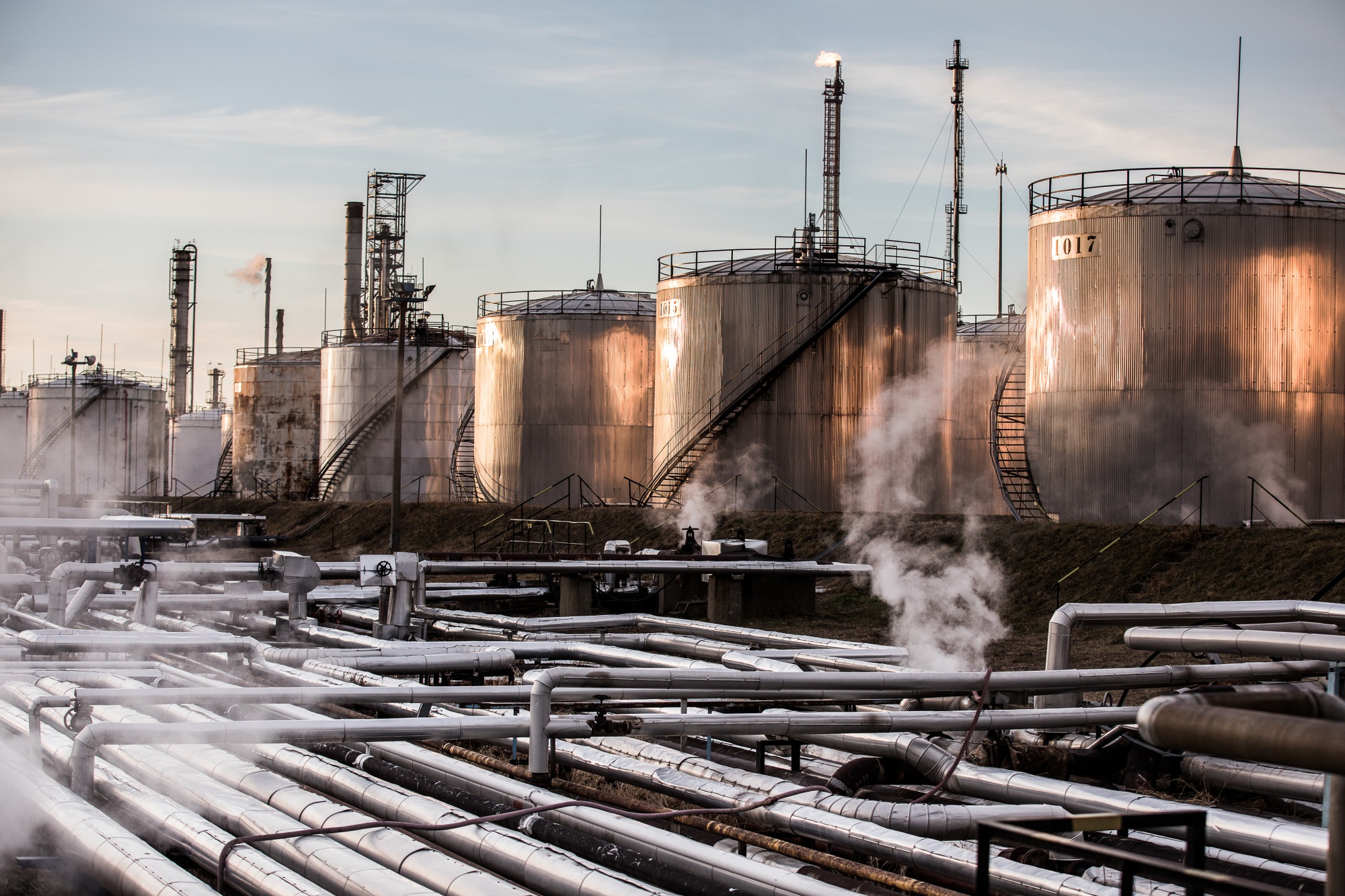 Storage tanks stand in the Duna oil refinery, operated by MOL Hungarian Oil & Gas Plc, in Szazhalombatta, Hungary, on Monday, Feb. 13, 2019. Oil traded near a three-month high as output curbs by OPEC tightened global supply while trade talks between the U.S. and China lifted financial markets. Photographer: Akos Stiller/Bloomberg