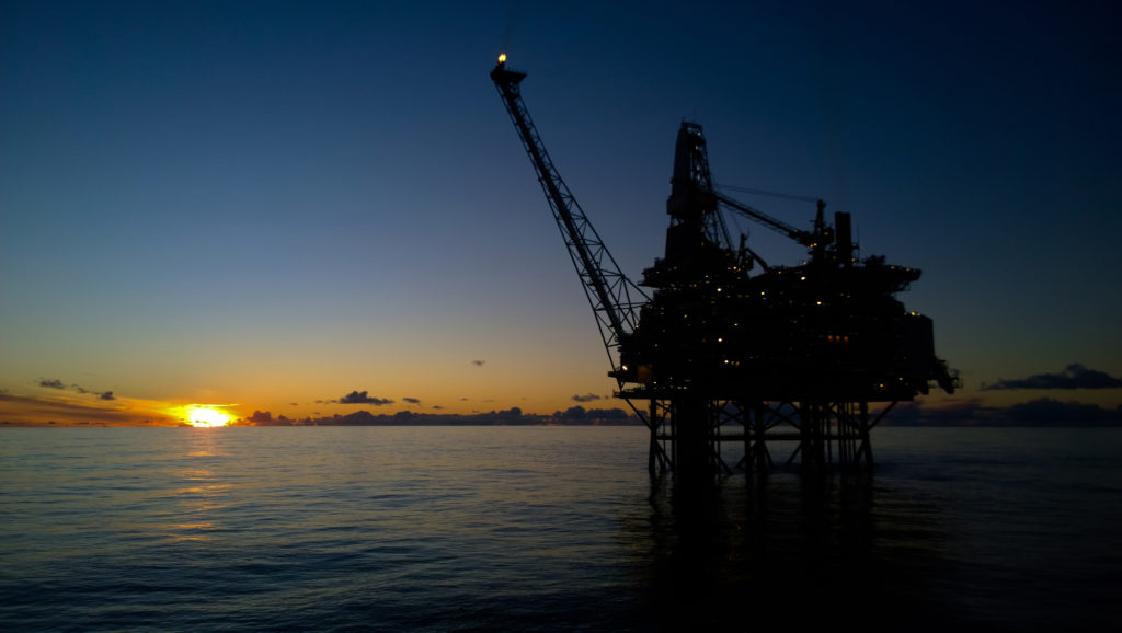 Offshore oil rig in sunset