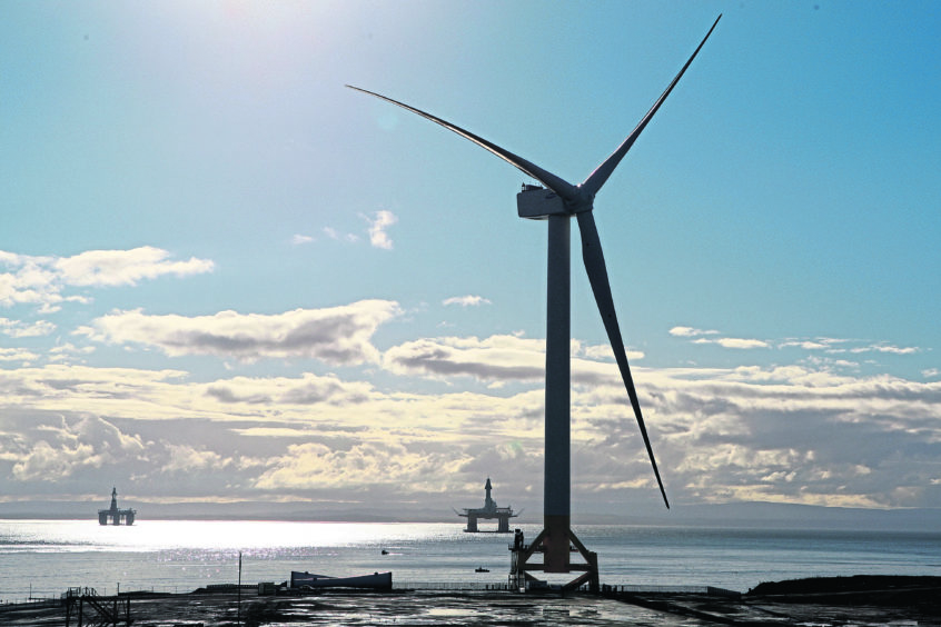 Kris Miller, Courier, 12/10/15. Picture todya at Methil Docks where oil and gas platforms sit out the bay behind a giant wind turbine. For files and any story about oil industry or renewables.