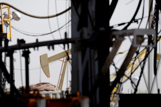 A pumpjack is seen as U.S. Vice President Mike Pence, not pictured, tours a Diamondback Energy Inc. oil rig in Midland, Texas, U.S., on Wednesday, April 17, 2019. Pence gave remarks to employees regarding the impacts of the Administration's United States-Mexico-Canada Agreement. Photographer: Callaghan O'Hare/Bloomberg