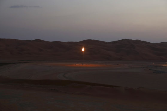 Flames burn off at an oil processing facility in Saudi Aramco's oilfield in the Rub' Al-Khali (Empty Quarter) desert in Shaybah, Saudi Arabia, on Tuesday, Oct. 2, 2018. Photographer: Simon Dawson/Bloomberg