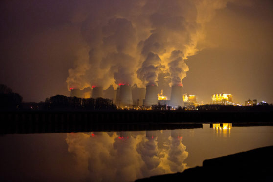 Chimneys emit vapor at Jaenschwalde lignite power plant in Germany, operated Vattenfall. Photographer: Krisztian Bocsi/Bloomberg