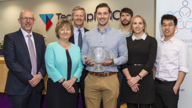 The photo caption is: (left to right): Bill Morrice, Lynda Armstrong (ECITB Chair), Chris Claydon (behind), Steven Gillan, Shaun Riddell, Katie Roberts and Zane Tan.