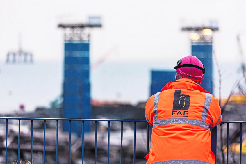 Worker looks out over the yard at BiFab in Methil