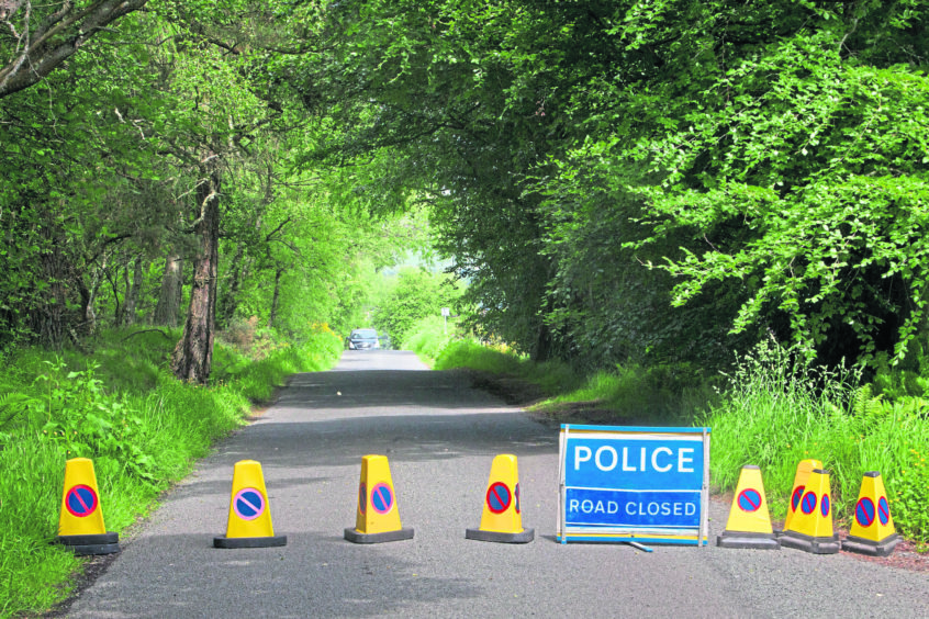 police: The roadblock at Egnanoss Road behind Westmuir. Photograph by Paul Reid