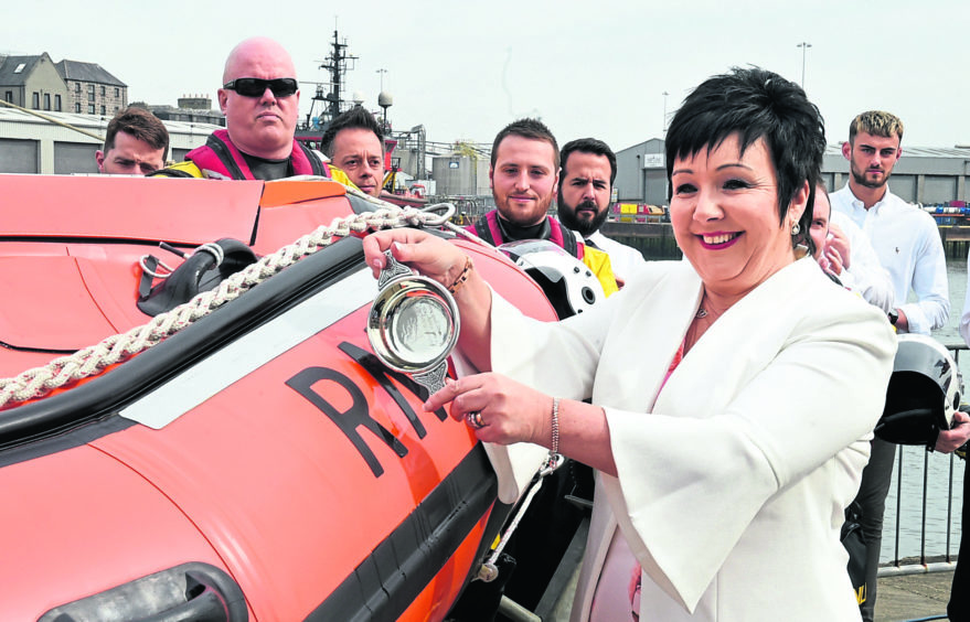 I name this ship: Audrey Wood christens the Buoy Woody 85, named after her son who died in a helicopter crash. Photographs by Jim Irvine