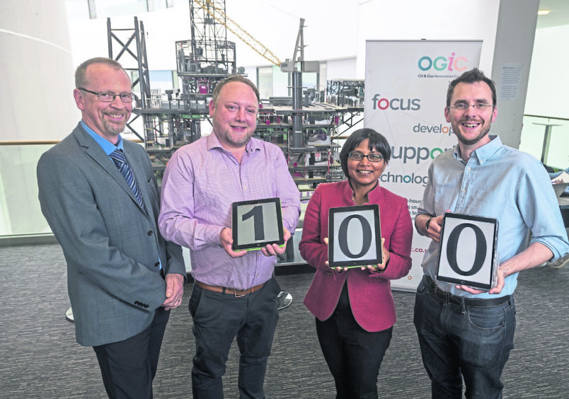 Photo Caption  Left-right: OGIC project manager, Mark Robertson, Targe Environmental Consulting managing director, Liam Manderson, RGU research professor, Nirmalie Wiratunga, and RGU lecturer, David Corsar.