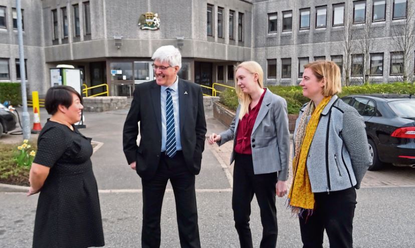 WEstern Isles Council's Iain Maviver welcomes Ofgems senior officials Cathryn Scott, Beth Hanna and Lois Griffin to Stornoway.