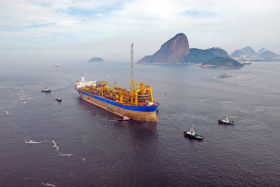 Exxon Mobil Corp., Royal Dutch Shell Plc and other energy giants are set to vie for deep-sea deposits that could hold 15 billion barrels of oil, almost twice as much as Norway’s reserves.
Pic: A floating production vessel seen near Guanabara Bay, Rio de Janeiro, Brazil