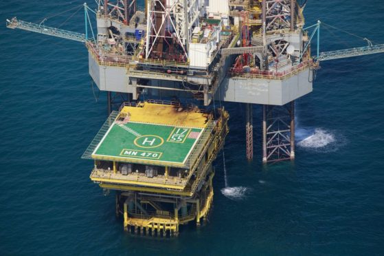 An offshore drilling platform stands in shallow waters at the Manifa offshore oilfield, operated by Saudi Aramco, in Manifa, Saudi Arabia, on Wednesday, Oct. 3, 2018. Saudi Aramco aims to become a global refiner and chemical maker, seeking to profit from parts of the oil industry where demand is growing the fastest while also underpinning the kingdoms economic diversification. Photographer: Simon Dawson/Bloomberg