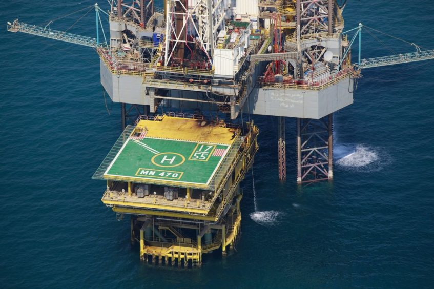 An offshore drilling platform stands in shallow waters at the Manifa offshore oilfield, operated by Saudi Aramco, in Manifa, Saudi Arabia, on Wednesday, Oct. 3, 2018. Saudi Aramco aims to become a global refiner and chemical maker, seeking to profit from parts of the oil industry where demand is growing the fastest while also underpinning the kingdoms economic diversification. Photographer: Simon Dawson/Bloomberg