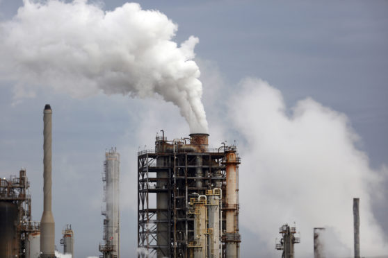 Emissions rise from the Royal Dutch Shell Plc Norco Refinery in Norco, Louisiana, U.S., on Friday, Feb. 9, 2018. Luke Sharrett/Bloomberg