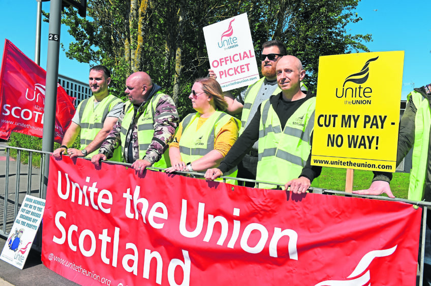 Aberdeen Airport staff are on strike over pay and pensions. Pic: Kenny Elrick.