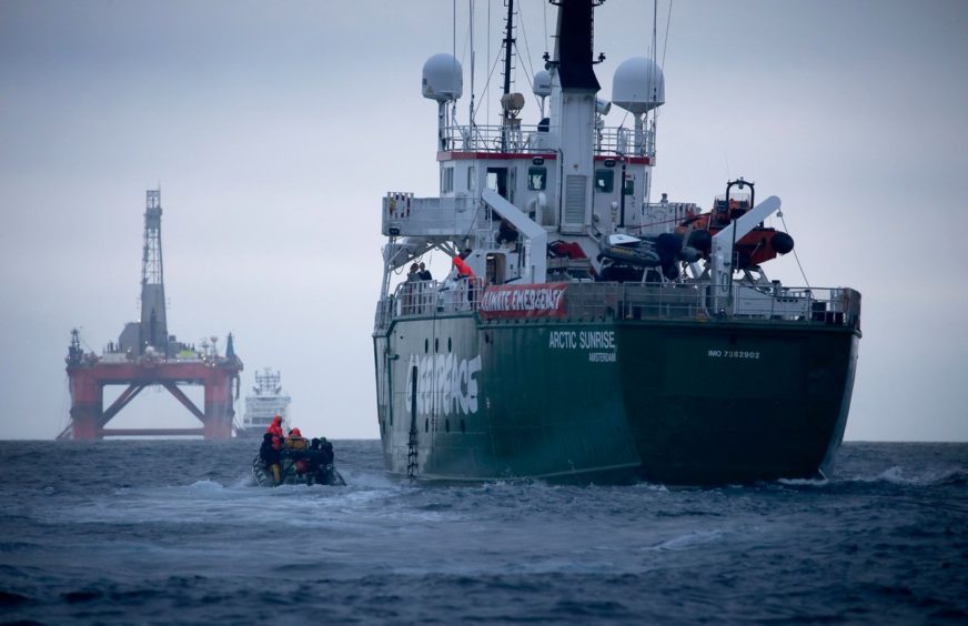 Arctic Sunrise with the Transocean Paul B Lloyd Jr rig in the background. Pic: Greenpeace