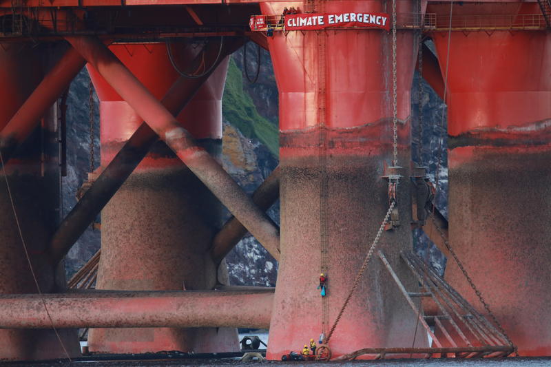 Greenpeace climbers on an oil rig in Cromarty Firth.