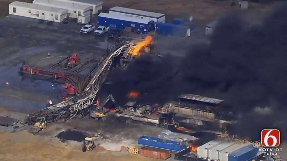 n this photo provided from a frame grab from Tulsa's KOTV/NewsOn6.com, fires burn at an eastern Oklahoma drilling rig near Quinton, Okla., Monday Jan. 22, 2018. Five people are missing after a fiery explosion ripped through a drilling rig, sending plumes of black smoke into the air and leaving a derrick crumpled on the ground, emergency officials said. (Christina Goodvoice, KOTV/NewsOn6.com via AP)