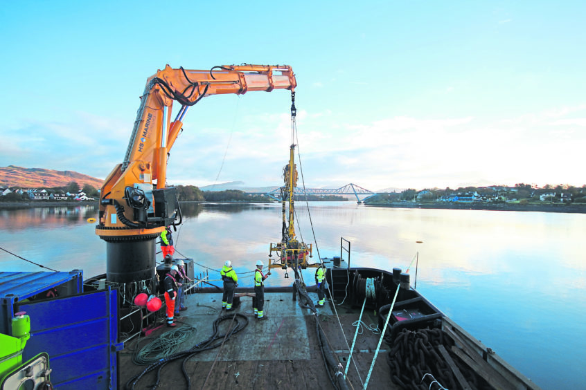 A remotely-operated vehicle (ROV) goes overboard