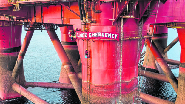 Greenpeace activists on a Transocean drilling rig.