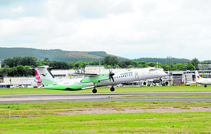 ON SCHEDULE: A Widerøe plane at Aberdeen International Airport, where more flights have been scheduled