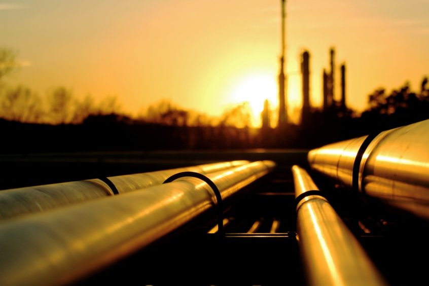 Sunrise over oil pipelines.