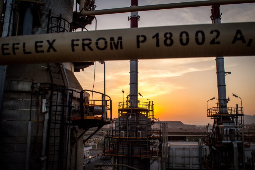 The sun sets beyond processing facilities at the Persian Gulf Star Co. (PGSPC) gas condensate refinery in Bandar Abbas, Iran, on Wednesday, Jan. 9. 2019. The third phase of the refinery begins operations next week and will add 12-15 million liters a day of gasoline output capacity to the plant, Deputy Oil Minister Alireza Sadeghabadi told reporters. Photographer: Ali Mohammadi/Bloomberg
