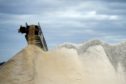 Crushed ore falls from a schute onto a stockpile at Bald Hill Lithium mine site, one of Tawana's operations, outside of Widgiemooltha, Western Australia, on Monday, Aug. 6, 2018. Photographer: Carla Gottgens/Bloomberg