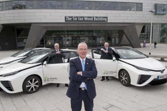 From left, RGU Director of Estates and Properties Services Bill Somerville, Councillor Philip Bell and Co-wheels Car Club Scotland Manager Tony Archer