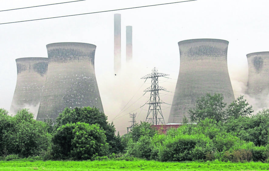 A controlled explosion brings down a cooling tower at Ferrybridge Power Station, in West Yorkshire. PRESS ASSOCIATION Photo. Picture date: Sunday July 28, 2019. The demolition came after its owners, energy company SSE, made the decision to close the coal-fired power station, which generated its final electricity in March 2016. See PA story SOCIAL Ferrybridge . Photo credit should read: Amy Murphy/PA Wire