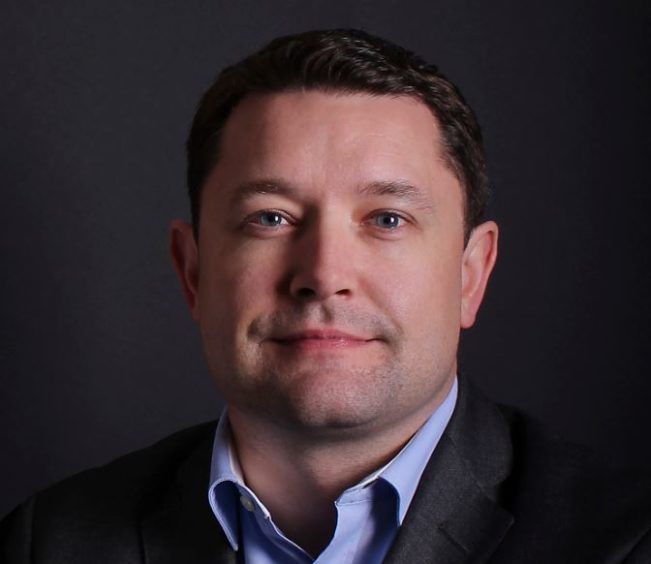 Head shot of man wearing suit