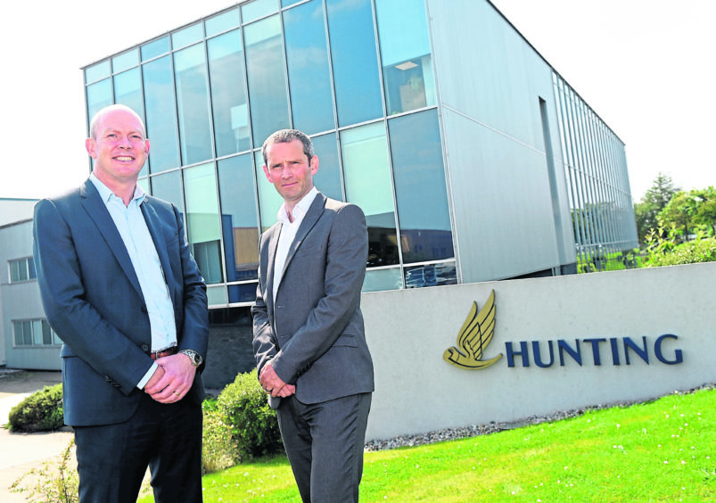 Bruce Ferguson, finance director of Hunting and Roger Findlay, Organic Oil Recovery General Manager at the firm's base in Badentoy.