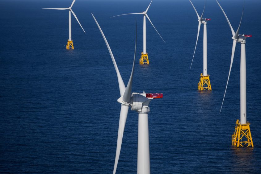 The GE-Alstom Block Island Wind Farm stands in this aerial photograph taken above the water off Block Island, Rhode Island, U.S., on Wednesday, Sept. 14, 2016. The installation of five 6-megawatt offshore-wind turbines at the Block Island project gives turbine supplier GE-Alstom first-mover advantage in the U.S. over its rivals Siemens and MHI-Vestas. Photographer: