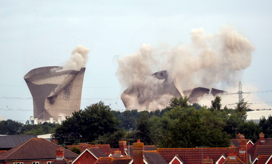 The cooling towers at the disused coal-fired Didcot power station in Oxfordshire are demolished. Steve Parsons/PA Wire
