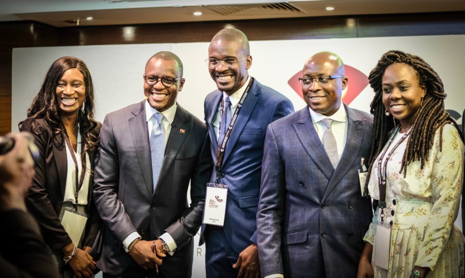 Smiling Angolans on a stage