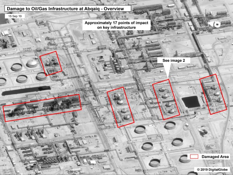 This image provided on Sunday, Sept. 15, 2019, by the U.S. government and DigitalGlobe and annotated by the source, shows damage to the infrastructure at Saudi Aramco's Abaqaiq oil processing facility in Buqyaq, Saudi Arabia. The drone attack Saturday on Saudi Arabia's Abqaiq plant and its Khurais oil field led to the interruption of an estimated 5.7 million barrels of the kingdom's crude oil production per day, equivalent to more than 5% of the world's daily supply. (U.S. government/Digital Globe via AP)