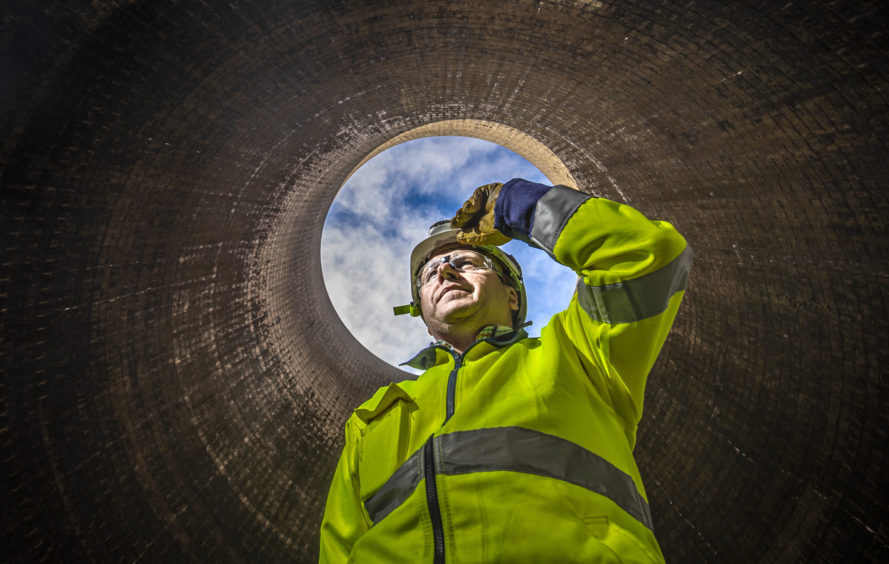 A worker in a cooling tower at Ferrybridge C Power Station in West Yorkshire, before the plant's cooling towers are demolished in October. PA Photo. Picture date: Thursday September 12, 2019. Photo credit should read: Danny Lawson/PA Wire