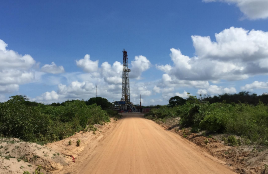 Dusty road leads to drilling rig