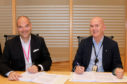 Christian Busengdal (left), European business director for Sinomine Specialty Fluids and Jarle Gaard, procurement manager at Equinor, sign a long-term contract for supply of cesium drilling and completion fluids on the Norwegian Continental Shelf.