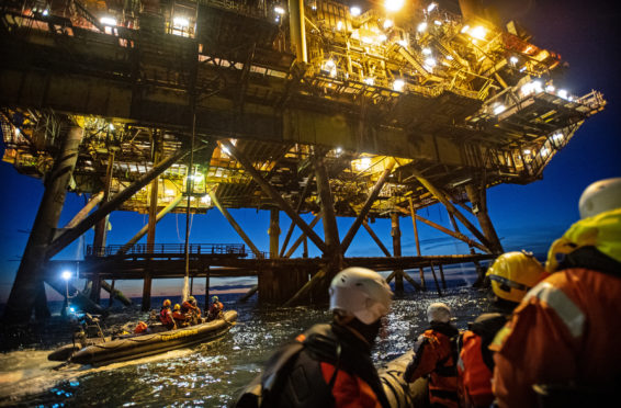Brent protest. Two activists climbed the Brent alpha, while another two boarded the legs of the Brent Bravo. Pic: Greenpeace