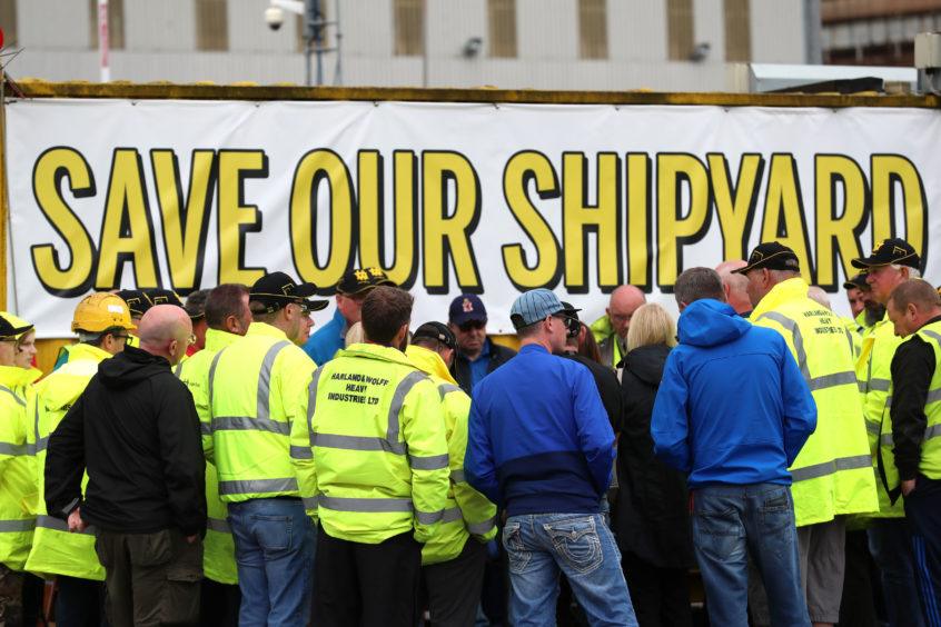 Harland and Wolff workers listen to union officials from Unite and GMB during an occupation of the shipyard in Belfast in a campaign to save it. Liam McBurney/PA Wire
