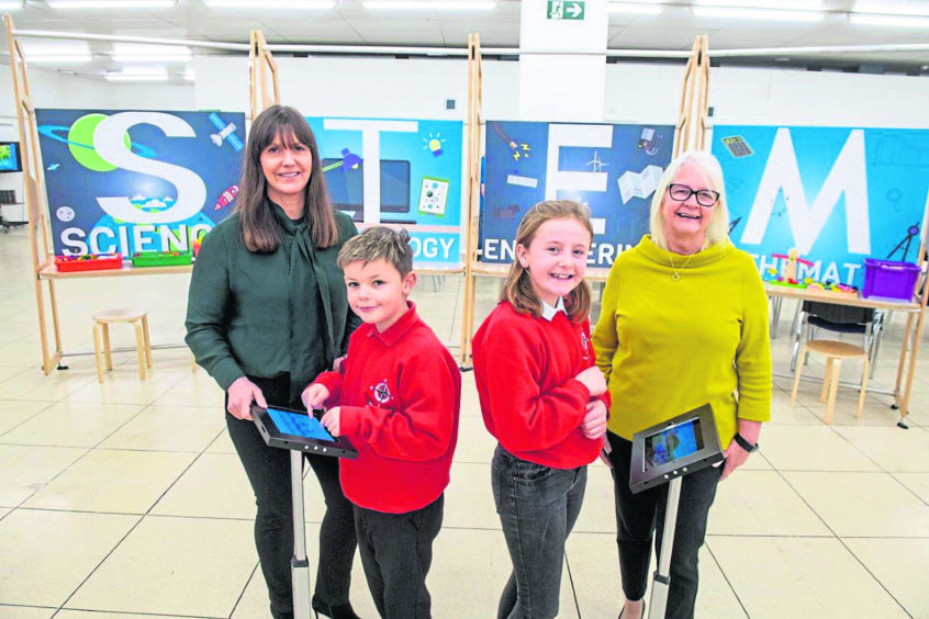 (L-R): Jill Glennie - director of external affairs at OPITO, Ain Gibson (10) – P6 pupil from Whitehills School, Grace Milne (10) - P6 pupil from Whitehills School and Liz Hodge from Aberdeen Science Centre.