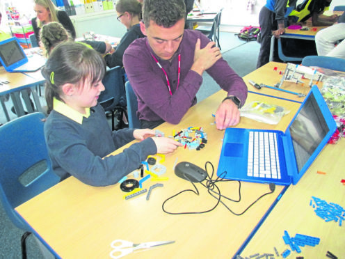 Schools: John Polson, assistant project manager at ROVOP, with team members from St Margaret’s School for Girls.