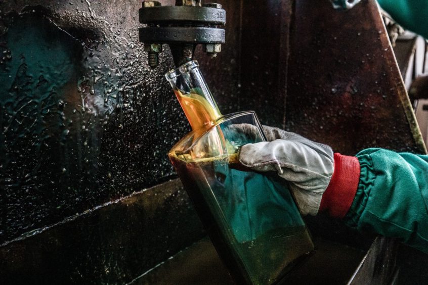 MOL employee takes samples in the Duna oil refinery, operated by MOL Hungarian Oil & Gas Plc, in Szazhalombatta, Hungary, on Wednesday, February 13, 2019.