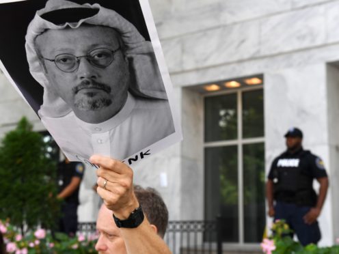 WASHINGTON, DC - OCTOBER 10: Michael Beer holds a poster during a rally about the disappearance of Washington Post journalist, Jamal Khashoggi outside the Embassy of Saudi Arabia on Wednesday October 10, 2018 in Washington, DC. Khashoggi disappeared after entering the Saudi Consulate in Instanbul. (Photo by Matt McClain/The Washington Post via Getty Images)