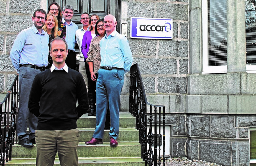 Accord Energy Solutions managing director James Arthur, front, with some of the firm's staff.