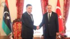 Turkish President Recep Tayyip Erdogan shakes hands with GNA Prime Minister Fayez al-Serraj on the ceasefire in Libya