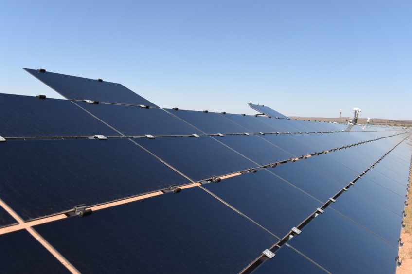 Solar panels under a blue sky