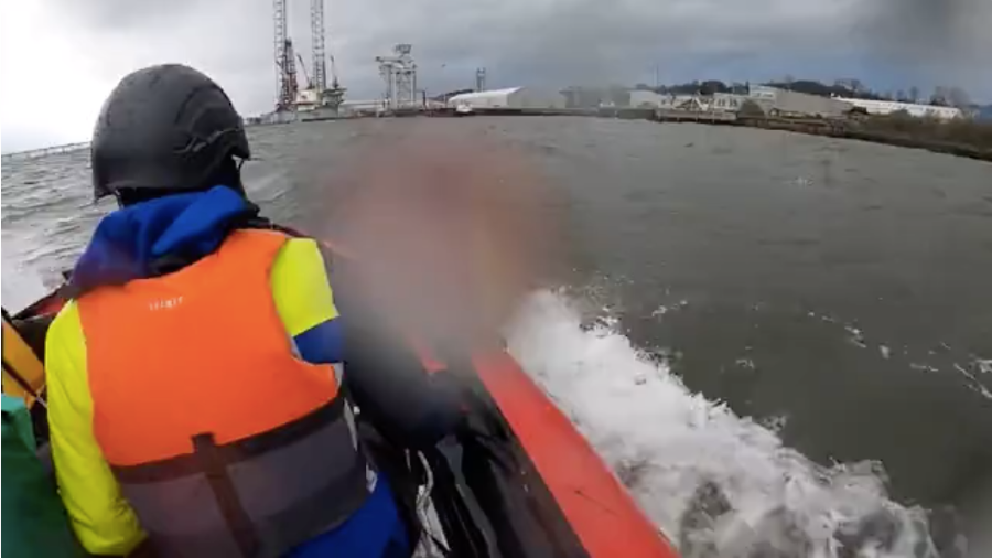 Extinction Rebellion activists approaching an oil rig in Dundee port.
