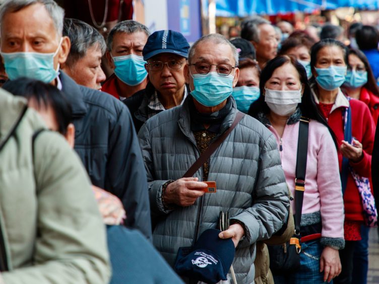 Mandatory Credit: Photo by Kevin On Man Lee/Penta Press/REX/Shutterstock (10544698g)
Seniors line up for free mask distributed by a shop. There is a citywide shortage of surgical mask in Hong Kong.
Coronavirus outbreak, China - 31 Jan 2020