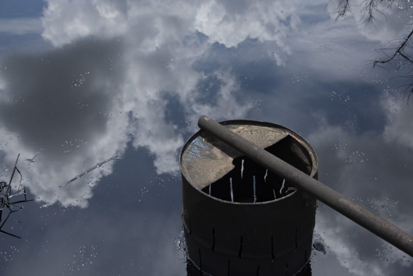 A rusty tank rests on a spill , in the Ayacucho block of the Orinoco belt in El Tigre  Anzoategui state  on Friday, October 12, 2018